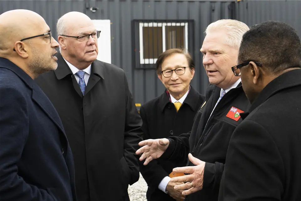 Hans Jain speaking with Doug Ford at corporate event