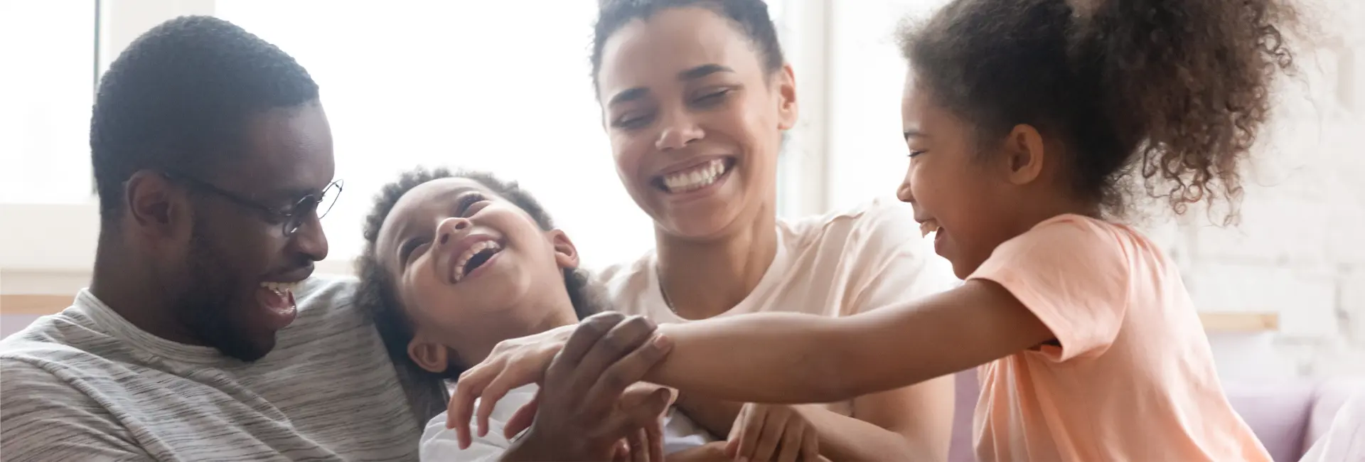 Happy family using resident portal in Toronto apartment rental community - Atria Development